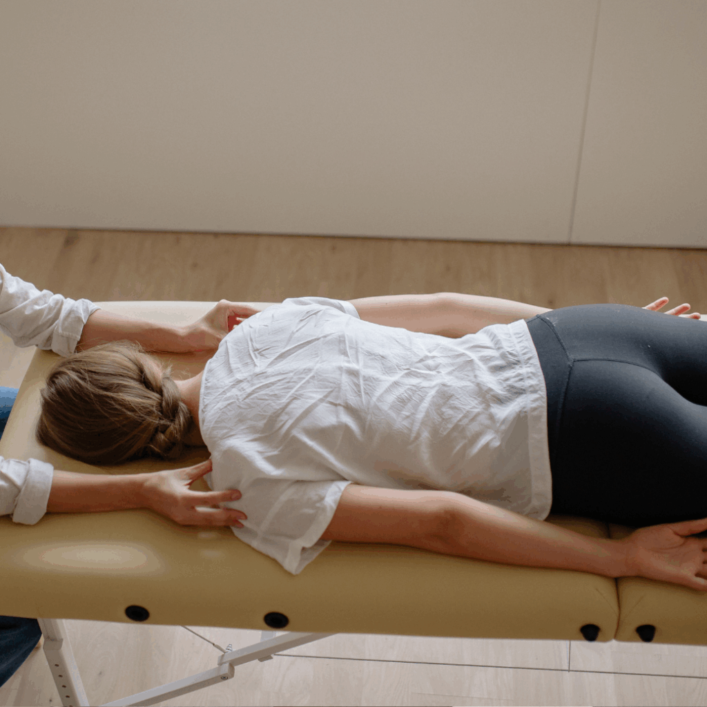 Chiropractor performing a gentle spinal adjustment on a patient at Charleston Chiropractic Associates in West Ashley